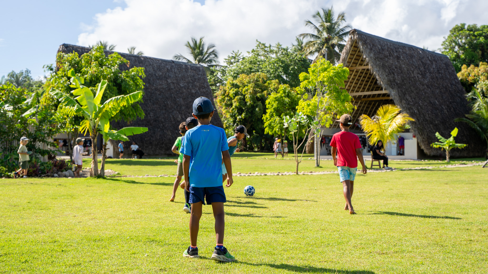 Students playing football on The School House campus